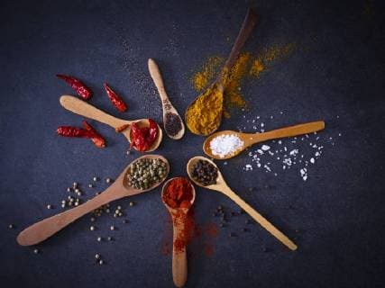 Variety of spices on wooden spoons  KSWF01896