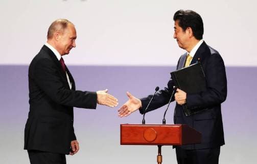 MOSCOW, RUSSIA â€“ MAY 26, 2018: Russia s President Vladimir Putin (L) and Japan s Prime Minister Shinzo Abe at a concert marking the start of the Russia-Japan Year of Culture at the Bolshoi Theatre. Sergei Savostyanov TASS  TS0817B6