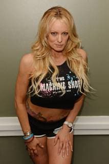 MIAMI BEACH, FL - MAY 26: Stormy Daniels poses during a photo session in a Miami Beach studio, Stormy Daniels directed the music video She Likes Guns for music artist Granny 4 Barrel which was just released last month on May 26, 2018 in Miami Beach, Florida. Copyright: xmpi04x