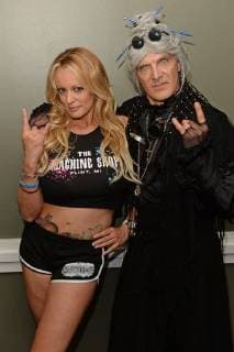 MIAMI BEACH, FL - MAY 26: Stormy Daniels and Granny 4 Barrel pose during a photo session in a Miami Beach studio, Stormy Daniels directed the music video She Likes Guns for music artist Granny 4 Barrel which was just released last month on May 26, 2018 in Miami Beach, Florida. Copyright: xmpi04x