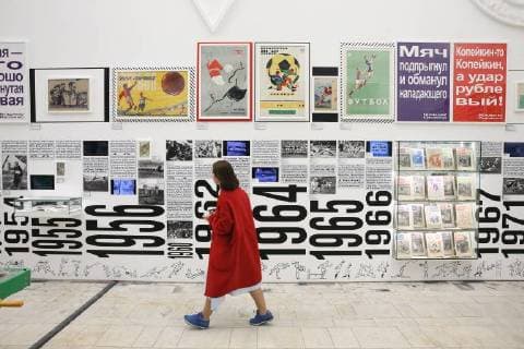 MOSCOW, RUSSIA - JUNE 1, 2018: A girl views an exhibition on the 1897-2018 history of Russian football at the VDNKh exhibition centre. The exhibition covers the history of Russian and Soviet football from the first football team in the Russian Empire (1897) up to the present times. Alexander Shcherbak TASS  TS0822B8