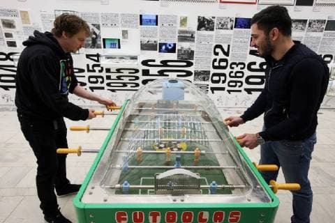 MOSCOW, RUSSIA - JUNE 1, 2018: Men play table football at an exhibition on the 1897-2018 history of Russian football at the VDNKh exhibition centre. The exhibition covers the history of Russian and Soviet football from the first football team in the Russian Empire (1897) up to the present times. Alexander Shcherbak TASS  TS0822D6