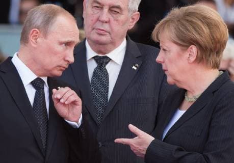 - OUISTREHAM, FRANCE: Russia s Prime Minister Vladimir Putin and German Chancellor Angela Merkel pictured during a ceremony as part of the events marking the 70th anniversary of the World War II Allied landings in Normandy in June 1944, in Ouistreham, France, Friday 06 June 2014. BENOITxDOPPAGNE  x58953663x