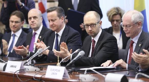 - BRUSSELS, BELGIUM: Finland s prime minister Jyrki Katainen, Sweden Prime Minister Frederik Reinfeldt, British Prime Minister David Cameron, Ukrainian Prime Minister Arseniy Yatsenyuk and European Council President Herman Van Rompuy pictured during the signature of an agreement with Ukraine on the second day of the EU summit of heads of state and government, at the EU headquarters in Brussels, Friday 21 March 2014. POOLxOLIVIERxHOSLET  x56305921x