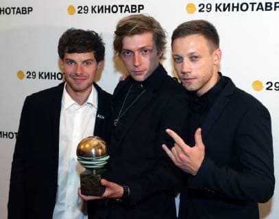 SOCHI, RUSSIA - JUNE 10, 2018: Director Alexander Gorchilin (C) holds his award for the best debut for his film Acid at the closing ceremony of the 29th Kinotavr Film Festival. Vyacheslav Prokofyev TASS  TS0836B6