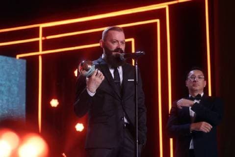 SOCHI, RUSSIA - JUNE 10, 2018: Director Grigory Konstantinopolsky (L), the winner of the Best Direction award for his film Russian Psycho, at the closing ceremony of the 29th Kinotavr Film Festival. Vyacheslav Prokofyev TASS  TS0836E0