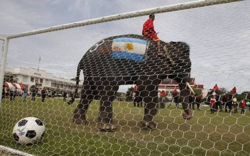Thailand: World Cup elephant Elephants play soccer with Thai students at a school in Thailand s Ayutthaya province. The match was held as part of a campaign to promote the 2018 World Cup and also to discourage gambling during the competition. Ayutthaya Thailand  ChaiwatxSubprasom