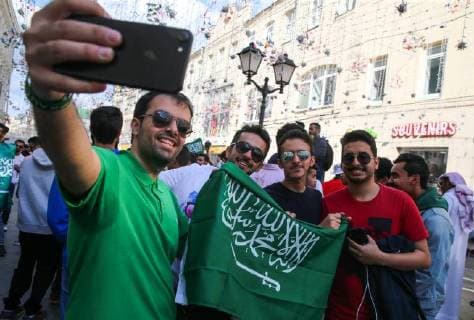 MOSCOW, RUSSIA - JUNE 13, 2018: Fans make a selfie on the eve of the 2018 FIFA World Cup in Nikolskaya Street. Vladimir Gerdo TASS  TS083E87