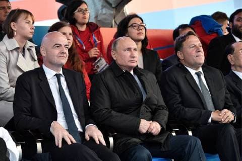 MOSCOW, RUSSIA â€“ JUNE 13, 2018: FIFA President Gianni Infantino, Russia s President Vladimir Putin, and Panama s President Juan Carlos Varela (L-R) watch a concert by opera stars ahead of the 2018 FIFA World Cup, at Moscow s Red Square. Alexei Nikolsky Russian Presidential Press and Information Office TASS  TS083F4C