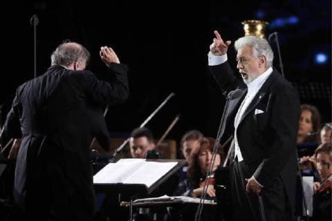 MOSCOW, RUSSIA â€“ JUNE 13, 2018: Mariinsky Theatre artistic director, conductor Valery Gergiev (L) and tenor Placido Domingo perform during concert by opera stars ahead of the 2018 FIFA World Cup, at Moscow s Red Square. Mikhail Metzel TASS  TS083FD8