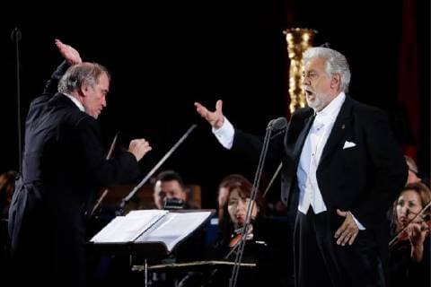 MOSCOW, RUSSIA â€“ JUNE 13, 2018: Mariinsky Theatre artistic director, conductor Valery Gergiev (L) and Spanish tenor Placido Domingo perform during concert by opera stars ahead of the 2018 FIFA World Cup, at Moscow s Red Square. Mikhail Metzel TASS  TS083FDA