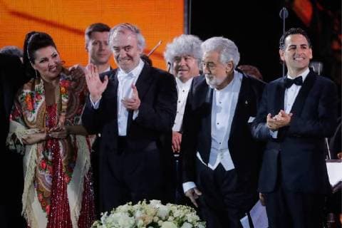 MOSCOW, RUSSIA â€“ JUNE 13, 2018: Russian soprano Anna Netrebko, Mariinsky Theatre artistic director, conductor Valery Gergiev, Spanish tenor Placido Domingo, and Peruvian tenor Juan Diego Florez (L-R) perform during concert by opera stars ahead of the 2018 FIFA World Cup, at Moscow s Red Square. Mikhail Metzel TASS  TS083FE0