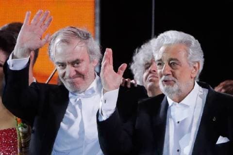 MOSCOW, RUSSIA â€“ JUNE 13, 2018: Mariinsky Theatre artistic director, conductor Valery Gergiev (L) and Spanish tenor Placido Domingo acknowledge the audience after a concert by opera stars ahead of the 2018 FIFA World Cup, at Moscow s Red Square. Mikhail Metzel TASS  TS083FEA