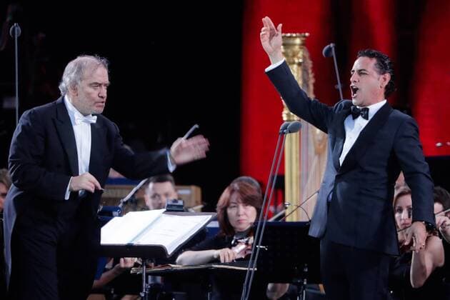 MOSCOW, RUSSIA â€“ JUNE 13, 2018: Mariinsky Theatre artistic director, conductor Valery Gergiev (L) and Peruvian tenor Juan Diego Florez perform during a concert by opera stars ahead of the 2018 FIFA World Cup, at Moscow s Red Square. Mikhail Metzel TASS  TS084004