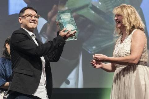 Singaporean director Yee Wei Chai (L) receives the Grand Prix (George Lucas Award) for his film Benjamin s Last Day At Katong Swimming Complex during the Short Shorts Film Festival & Asia 2018 (SSFF) Award Ceremony at Jingu Kaikan on June 17, 2018, Tokyo, Japan. SSFF is one of Asia s largest short film festivals held in Tokyo from June 4 to 24.  (gxta_SSFFawrd010)