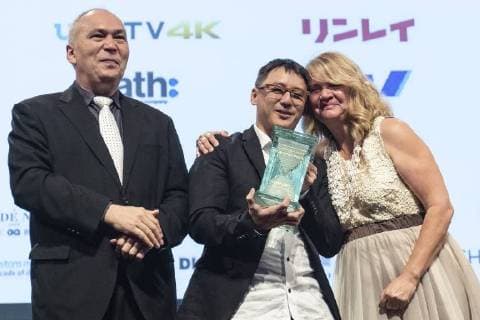 Singaporean director Yee Wei Chai (C) receives the Grand Prix (George Lucas Award) for his film Benjamin s Last Day At Katong Swimming Complex during the Short Shorts Film Festival & Asia 2018 (SSFF) Award Ceremony at Jingu Kaikan on June 17, 2018, Tokyo, Japan. SSFF is one of Asia s largest short film festivals held in Tokyo from June 4 to 24.  (gxta_SSFFawrd014)