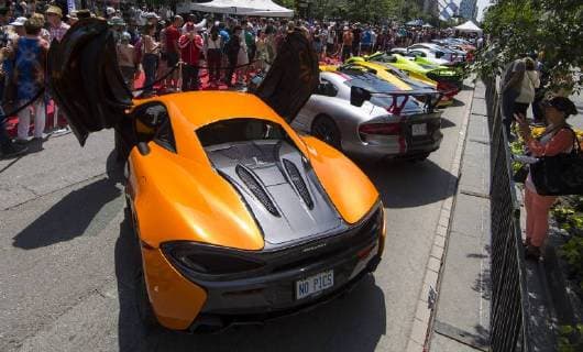 (180618) -- TORONTO, June 18, 2018 -- People visit the 2018 Yorkville Exotic Car Show on Bloor Street in Toronto, Canada, June 17, 2018. With over 110 classic and exotic cars, this annual event kicked off on Sunday. )(gj) CANADA-TORONTO-EXOTIC CAR SHOW ZouxZheng 