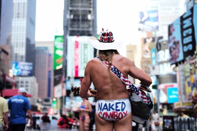 (180618) -- NEW YORK, June 18, 2018 -- Naked Cowboy Robert John Burck plays his guitar at Times Square in New York City, the United States, on June 18, 2018. Forecasted highs for Central Park, New York City, are expected to hit 95 degrees (35 degrees Celsius), which would tie a record that was set back in 1929. ) U.S.-NEW YORK-HEAT LixMuzi 
