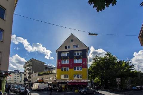 A giant Germany flag with a size of about 100 square meters hangs on the occasion of the Football World Cup 2018 in Russia on a house facade in Cologne Huge Germany flag