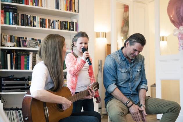 Happy family making music together at home model released Symbolfoto property released  MOEF01082