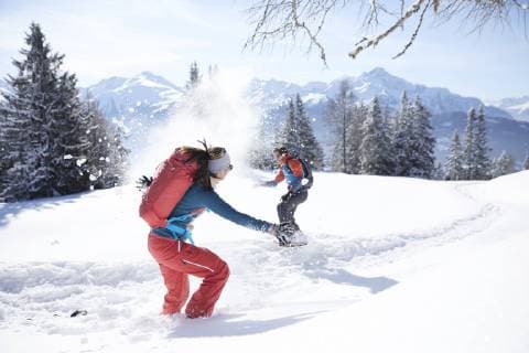 Austria, Tyrol, couple having fun in the snow model released Symbolfoto property released  CVF00435