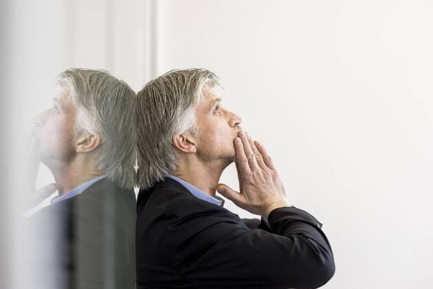 Desperate businessman leaning on window model released Symbolfoto property released  FMKF05042