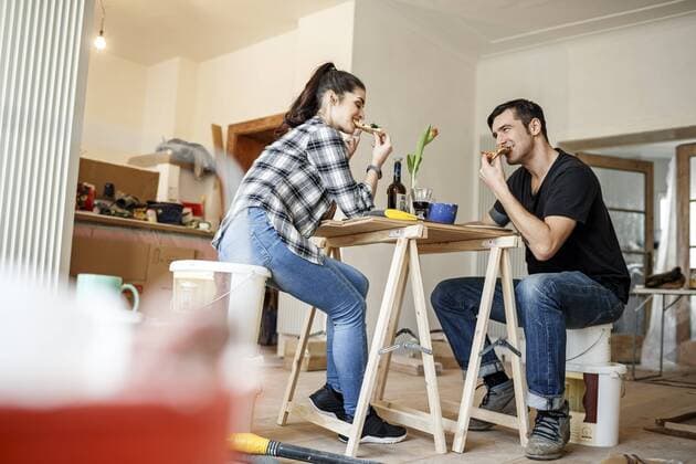 Happy couple renovating flat, taking a break, model released Symbolfoto property released  PESF01077