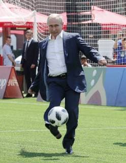 MOSCOW, RUSSIA - JUNE 28, 2018: Russia s President Vladimir Putin kicks the ball as he visits the 2018 FIFA World Cup Football Park in Red Square. Mikhail Metzel TASS  TS086D62