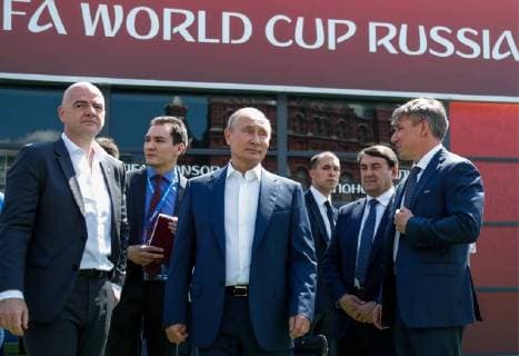 MOSCOW, RUSSIA - JUNE 28, 2018: FIFA President Gianni Infantino (L), Russia s President Vladimir Putin (C), and the Chairman and CEO of the 2018 FIFA World Cup Russia Local Organising Committee (LOC), Alexei Sorokin (R) visit the 2018 FIFA World Cup Football Park in Red Square; 2nd right: Adviser to the President of Russia Igor Levitin. Mikhail Metzel TASS  TS086D5D