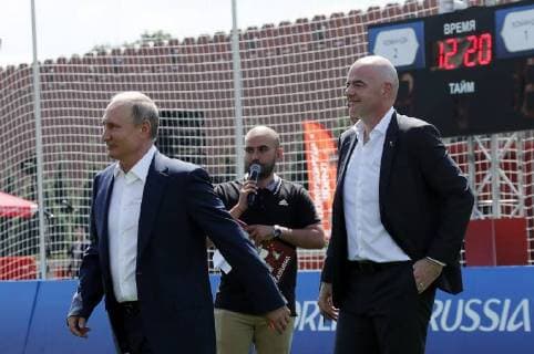MOSCOW, RUSSIA - JUNE 28, 2018: Russia s President Vladimir Putin (L) and FIFA President Gianni Infantino (R) visit the 2018 FIFA World Cup Football Park in Red Square. Mikhail Metzel TASS  TS086D6F
