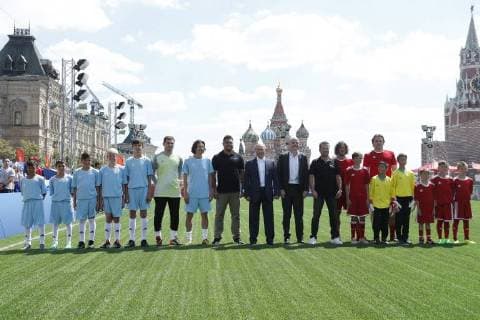 MOSCOW, RUSSIA - JUNE 28, 2018: Spanish football player Iker Casillas (6th L), 2018 FIFA World Cup Ambassador Alexei Smertin (7th L), Brazilian football player Ronaldo Luiz (8th L), Russia s President Vladimir Putin (9th L), FIFA President Gianni Infantino (10th L), German football player Lothar Matthaus (11th L), Spanish football player Carles Puyol (2nd R back), and Russian football player Dmitry Bulykin (R back), and young football players visit the 2018 FIFA World Cup Football Park in Red Square. Mikhail Metzel TASS  TS086D71