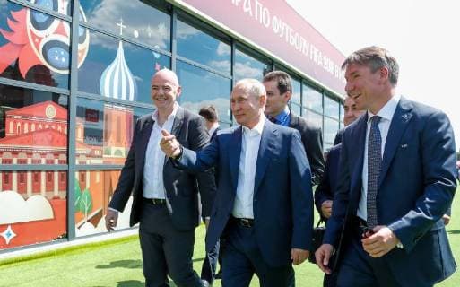 MOSCOW, RUSSIA - JUNE 28, 2018: FIFA President Gianni Infantino (L), Russia s President Vladimir Putin (C), and the Chairman and CEO of the 2018 FIFA World Cup Russia Local Organising Committee (LOC), Alexei Sorokin (R) visit the 2018 FIFA World Cup Football Park in Red Square. Mikhail Metzel TASS  TS086D5C