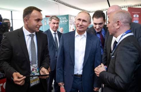 MOSCOW, RUSSIA - JUNE 28, 2018: Russia s President Vladimir Putin (C front), visits the 2018 FIFA World Cup Football Park in Red Square. Alexei Nikolsky Russian Presidential Press and Information Office TASS  TS086D7F