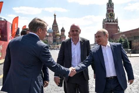 MOSCOW, RUSSIA - JUNE 28, 2018: The Chairman and CEO of the 2018 FIFA World Cup Russia Local Organising Committee (LOC) Alexei Sorokin (L), and Russia s President Vladimir Putin (R) shake hands as FIFA President Gianni Infantino (C) looks on during a visit to the 2018 FIFA World Cup Football Park in Red Square. Alexei Nikolsky Russian Presidential Press and Information Office TASS  TS086D79