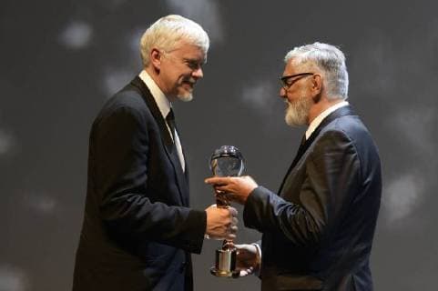 American actor and director Tim Robbins, left, receives a Crystal Globe Award for Outstanding Artistic Contribution to World Cinema from Festival President Jiri Bartoska during the 53d International Film Festival in Karlovy Vary (KVIFF), Czech Republic, on June 29, 2018. (CTKxPhoto KaterinaxSulova) CTKPhotoP201806290978801  _SUK9730