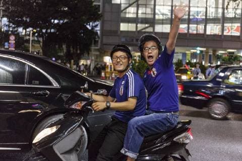June 29, 2018 - Tokyo, Japan - Japanese soccer fans celebrate in Shibuya after their team advanced to the second round of World Cup in Tokyo, Japan. Japan s Soccer National Team. Japan sealed their position to the second round of the FIFA World Cup despite losing to Poland 1-0 in Volgograd Arena in Volgograd, Russia. Soccer fans who watched the game in Tokyo gathered in Shibuya s famous scramble crossing to celebrate, the Tokyo Metropolitan Police were on hand to control access. Tokyo Japan - ZUMAm191 20180629_zap_m191_001 Copyright: xRodrigoxReyesxMarinx