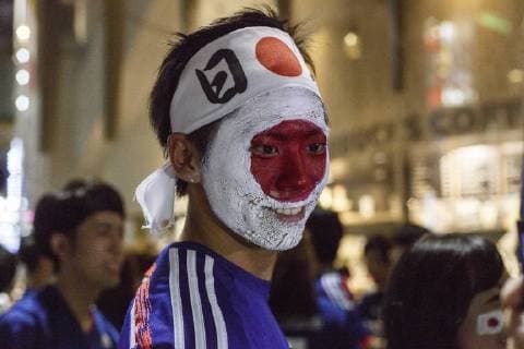 June 29, 2018 - Tokyo, Japan - Japanese soccer fans celebrate in Shibuya after their team advanced to the second round of World Cup in Tokyo, Japan. Japan s Soccer National Team. Japan sealed their position to the second round of the FIFA World Cup despite losing to Poland 1-0 in Volgograd Arena in Volgograd, Russia. Soccer fans who watched the game in Tokyo gathered in Shibuya s famous scramble crossing to celebrate, the Tokyo Metropolitan Police were on hand to control access. Tokyo Japan - ZUMAm191 20180629_zap_m191_014 Copyright: xRodrigoxReyesxMarinx