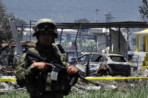 (180705) -- TULTEPEC (MEXICO), July 5, 2018 -- A soldier guards an area affected by explosions at a small fireworks factory in La Saucera, a neighborhood on the outskirts of Tultepec, Mexico, on July 5, 2018. Two explosions on Thursday at a small fireworks factory in central Mexico left at least 19 people dead, including firefighters and police officers, and another 40 people injured, local authorities said. ) MEXICO-TULTEPEC-FIREWORKS FACTORY-EXPLOSIONS FernandoxRamirez 