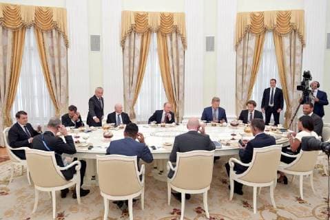 MOSCOW, RUSSIA â€“ JULY 6, 2018: Russia s President Vladimir Putin (C) meets with football stars at the Moscow Kremlin. Alexei Druzhinin Russian Presidential Press and Information Office TASS  TS088279