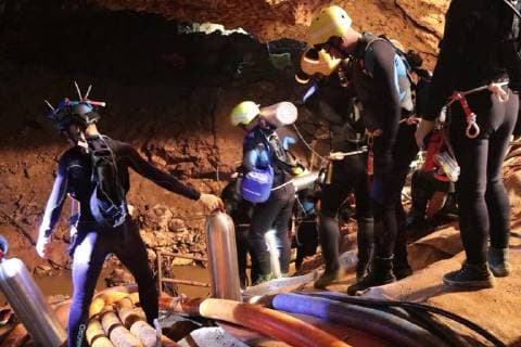 Members of the Royal Thai Navy along with volunteers from England, the United States, Australia, and China, are pictured as they prepare to rescue 12 schoolboys, members of a local soccer team, and their coach, from the Tham Luang Cave network in Northern Thailand. Two British volunteer divers found the missing boys Monday after a nine-day search.  WAX2018070708 ROYALxTHAIxNAVY