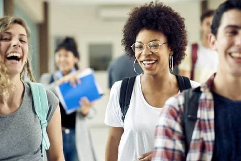 College students walking and laughing on campus  Copyright: FrédéricxCirou B67860831