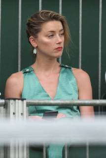 LONDON, ENGLAND - JULY 07: it s official THEY HAVE THEIR FIRST KISS Amber Heard wearing a low cut mint jumpsuit with new boyfriend Vito Schnabel attend day seven of the Wimbledon Tennis Championships at the All England Lawn Tennis and Croquet Club on July 7, 2018 in London, England..People: Vito Schnabel and Amber Heard London England - ZUMAs214 20180709_zba_s214_085 Copyright: xSMGx