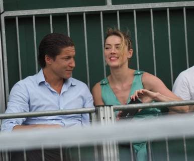 LONDON, ENGLAND - JULY 07: it s official THEY HAVE THEIR FIRST KISS Amber Heard wearing a low cut mint jumpsuit with new boyfriend Vito Schnabel attend day seven of the Wimbledon Tennis Championships at the All England Lawn Tennis and Croquet Club on July 7, 2018 in London, England..People: Vito Schnabel and Amber Heard London England - ZUMAs214 20180709_zba_s214_044 Copyright: xSMGx