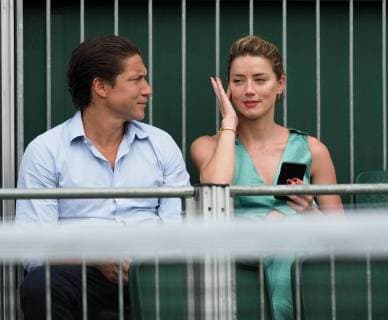 LONDON, ENGLAND - JULY 07: it s official THEY HAVE THEIR FIRST KISS Amber Heard wearing a low cut mint jumpsuit with new boyfriend Vito Schnabel attend day seven of the Wimbledon Tennis Championships at the All England Lawn Tennis and Croquet Club on July 7, 2018 in London, England..People: Vito Schnabel and Amber Heard London England - ZUMAs214 20180709_zba_s214_021 Copyright: xSMGx