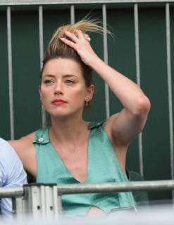 LONDON, ENGLAND - JULY 07: it s official THEY HAVE THEIR FIRST KISS Amber Heard wearing a low cut mint jumpsuit with new boyfriend Vito Schnabel attend day seven of the Wimbledon Tennis Championships at the All England Lawn Tennis and Croquet Club on July 7, 2018 in London, England..People: Vito Schnabel and Amber Heard London England - ZUMAs214 20180709_zba_s214_024 Copyright: xSMGx