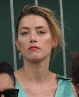 LONDON, ENGLAND - JULY 07: it s official THEY HAVE THEIR FIRST KISS Amber Heard wearing a low cut mint jumpsuit with new boyfriend Vito Schnabel attend day seven of the Wimbledon Tennis Championships at the All England Lawn Tennis and Croquet Club on July 7, 2018 in London, England..People: Vito Schnabel and Amber Heard London England - ZUMAs214 20180709_zba_s214_029 Copyright: xSMGx
