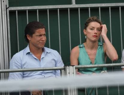 LONDON, ENGLAND - JULY 07: it s official THEY HAVE THEIR FIRST KISS Amber Heard wearing a low cut mint jumpsuit with new boyfriend Vito Schnabel attend day seven of the Wimbledon Tennis Championships at the All England Lawn Tennis and Croquet Club on July 7, 2018 in London, England..People: Vito Schnabel and Amber Heard London England - ZUMAs214 20180709_zba_s214_018 Copyright: xSMGx
