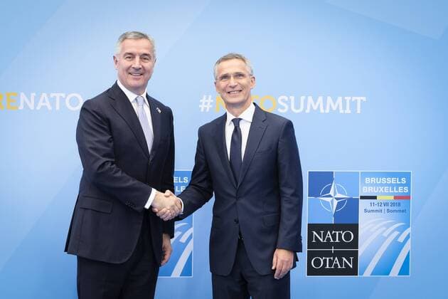 Montenegro President Milo Dukanovic and NATO Secretary General Jens Stoltenberg pictured during the handshake moment at the arrivals for a summit of the NATO (North Atlantic Treaty Organization) military alliance, Wednesday 11 July 2018, in Brussels.  POOLxSEBASTIENxPIRLET 05383506