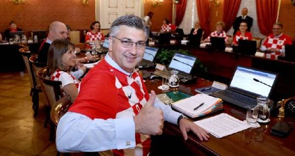 Croatian government in jerseys 12.07.2018. Zagreb, Croatia - Prime minister Andrej Plenkovic and other ministers during session of the government of the republic of Croatia dressed in Croatian national football team jersey after winning the match against England in semi-finals in Russia.  PatrikxMacek PIXSELL