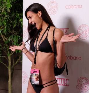 SI model hopeful number 0197 stands by a repeat wall during the Miami Swim Week at the W hotel in Miami Beach, Florida, July 13, 2018. For the first time Sports Illustrated Swimsuit will host an open model casting call July 13 & 14 2018 from 9AM ? 3PM, at the W hotel South Beach during Paraiso. More than 1500 potential stars will compete for the one spot in the 2019 issue of SI Swimsuit.  MIA20180712313 GARYxIxROTHSTEIN